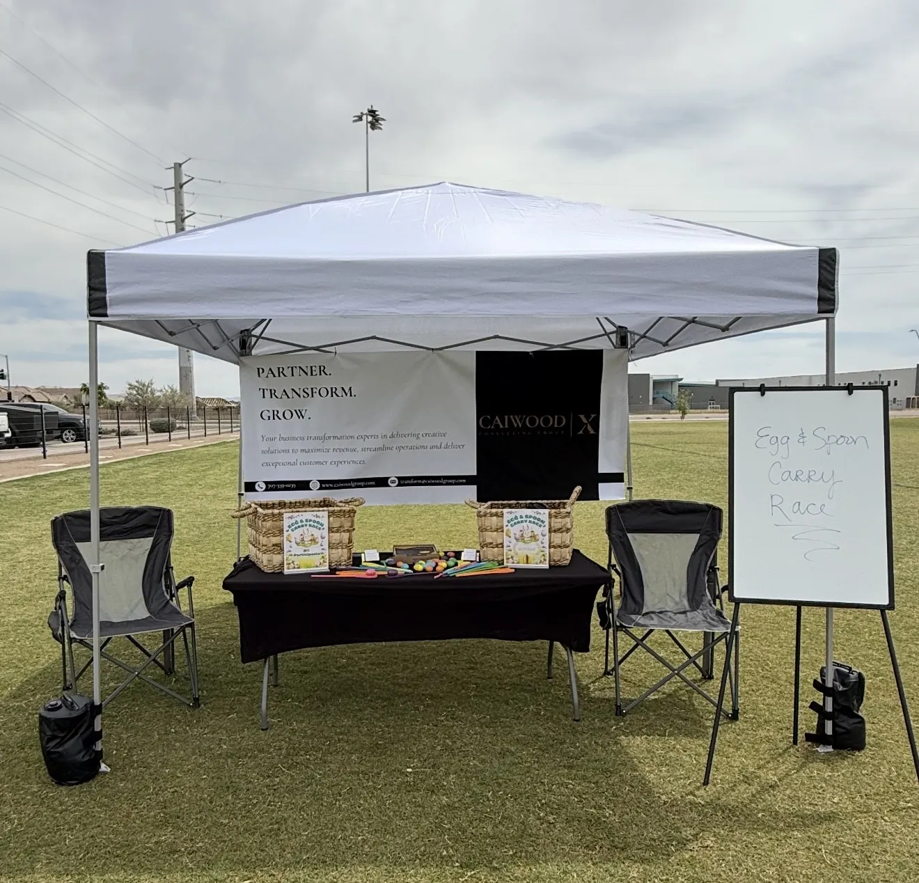 Caiwood X booth at the community egg hunt